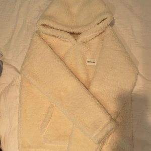 white very fluffy hoodie with pockets